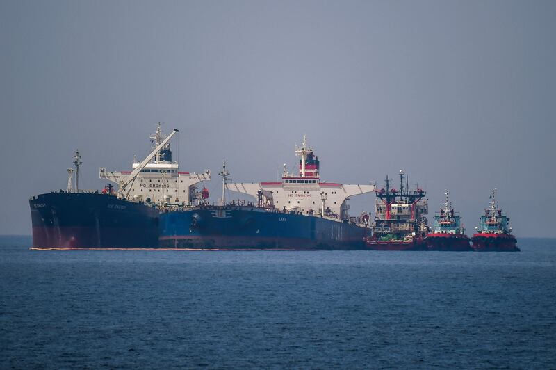 The Liberian-flagged oil tanker 'Ice Energy,' left, transfers crude oil from the Iranian-flagged 'Lana' near the Greek island of Evia on May 29. AFP