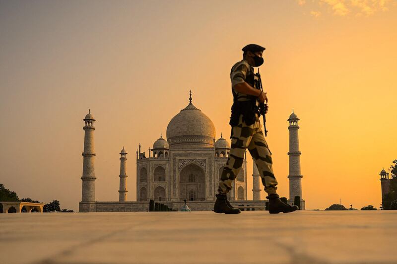 An Indian soldier patrols the Taj Mahal after it reopened to visitors following the easing of Covid-19 restrictions. AFP