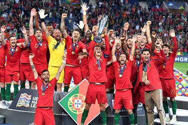 Portugal's Cristiano Ronaldo lifts up the trophy after winning the inaugural Uefa Nations League final on Sunday. AP