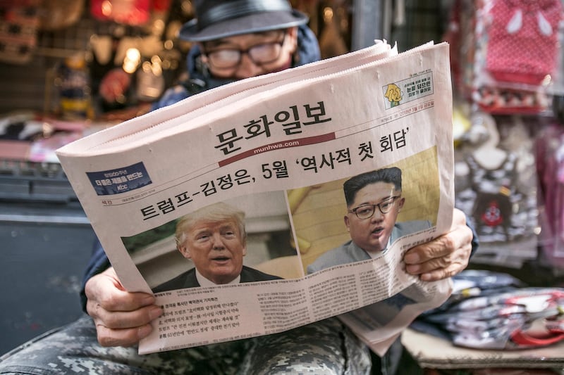 A man reads a copy of the Munhwa Ilbo newspaper featuring U.S. President Donald Trump and North Korean leader Kim Jong-un on the front page in Seoul, South Korea, on Friday, March 9, 2018. Trump hailed “great progress” in talks with North Korea after agreeing to meet Kim in what would be an unprecedented summit. Photographer: Jean Chung/Bloomberg