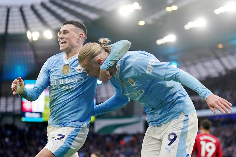 Manchester City's Erling Haaland celebrates scoring his side's third goal against Manchester United at the Etihad Stadium. PA