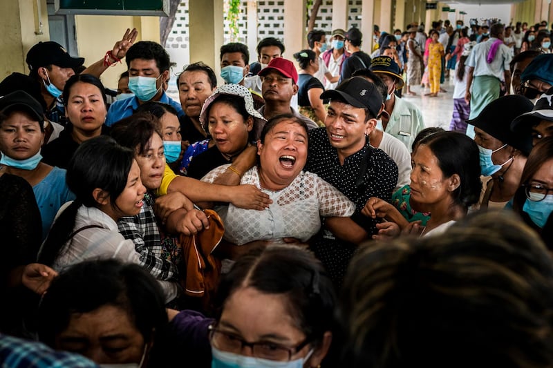 The mother of Aung Kaung Htet wails while mourning during a funeral for Aung, 15, who was killed when military junta forces opened fire on anti-coup protesters in Yangon. Getty Images