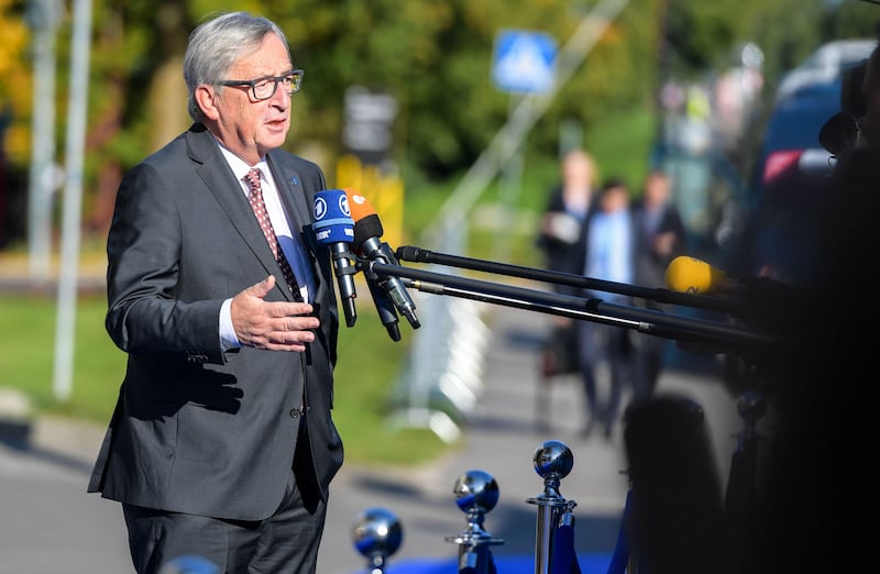 European Commission President Jean-Claude Juncker talks with journalists as he arrives for a European Union summit in Tallinn, Estonia, on September 29, 2017.
EU leaders hold a digital summit in the Estonian capital with French President Emmanuel Macron seeking to persuade his counterparts to overhaul European tax rules targeting Silicon Valley firms. / AFP PHOTO / JANEK SKARZYNSKI