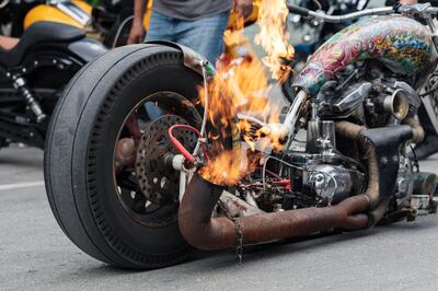A customised bike with a flaming exhaust from Saudi Arabia, pictured at last year’s Art of Motorcycle event. Photo: Cafe Racers Middle East