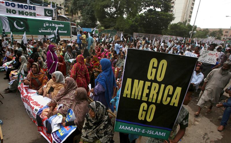 Pakistanis rally against America in Karachi, Pakistan, Wednesday, Aug. 30, 2017. Protesters objected to President Donald Trump's allegation that Islamabad is harboring militants who battle U.S. forces in Afghanistan. (AP Photo/Fareed Khan)