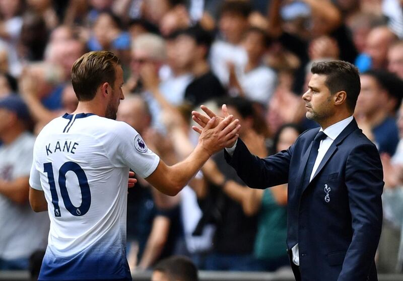 Tottenham's Harry Kane shakes hands with manager Mauricio Pochettino after being substituted during a Premier League match. Reuters