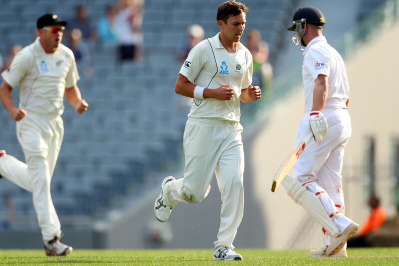 AUCKLAND, NEW ZEALAND - MARCH 23:  Trent Boult of New Zealand celebrates his wicket of Jonathan Trott of England (R) during day two of the Third Test match between New Zealand and England at Eden Park on March 23, 2013 in Auckland, New Zealand.  (Photo by Phil Walter/Getty Images)