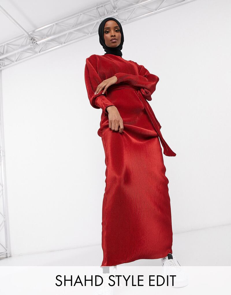 In deep rust, this dress is part of the edit by Shahd Batal for Asos