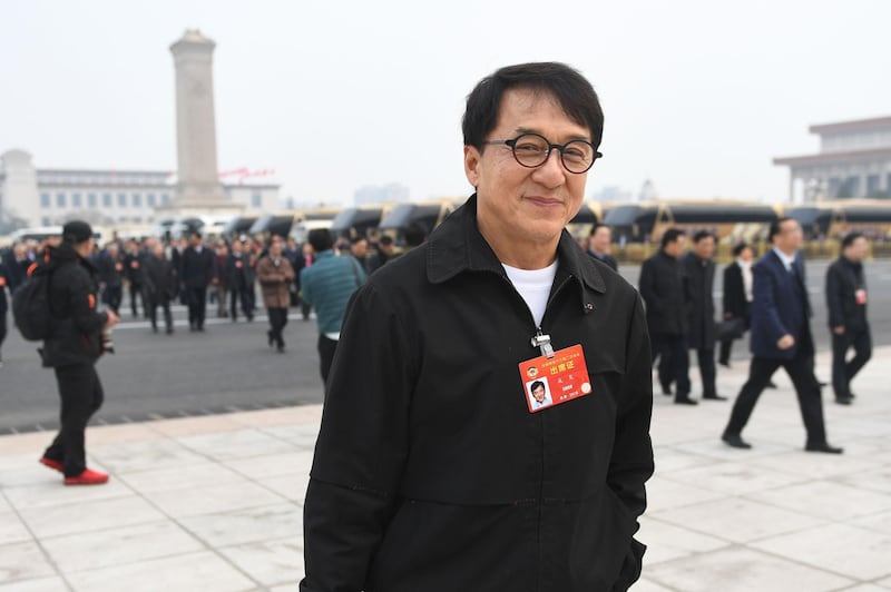 Hong Kong film actor Jackie Chan arrives at the Great Hall of the People for a plenary session of the Chinese People's Political Consultative Conference in Beijing on March 10, 2019. / AFP / GREG BAKER
