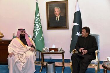 Crown Prince Mohammed bin Salman listens to Pakistani Prime Minister Imran Khan during a meeting in Islamabad. AP