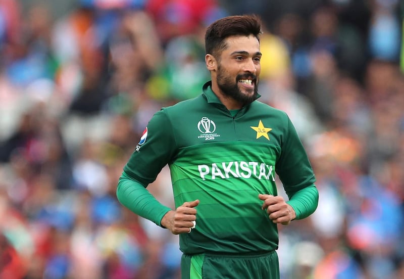 FILE - In this June 16, 2019 file photo, Pakistan's Mohammad Amir celebrates the dismissal of India's captain Virat Kohli during the Cricket World Cup match between India and Pakistan at Old Trafford in Manchester, England. Amir has retired from test cricket, saying he wants to focus on white-ball cricket. "It has been an honor to represent Pakistan in the pinnacle and traditional format of the game," the 27-year-old Amir said in a statement on Friday. "I, however, have decided to move away from the longer version so I can concentrate on white ball cricket." (AP Photo/Aijaz Rahi,file)