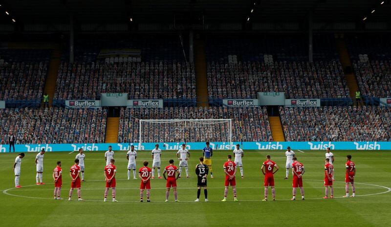 Players stand during a minutes silence in respect for the late Jack Charlton before the match. Reuters