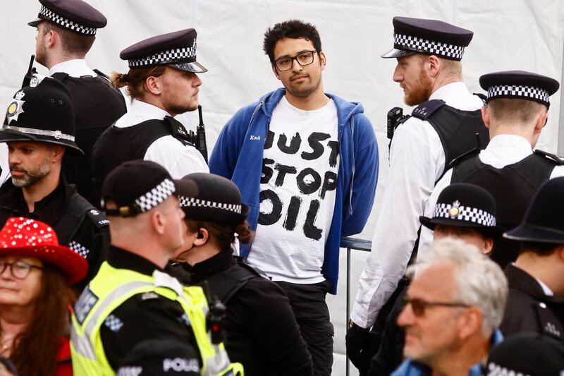 A Just Stop Oil campaigner is detained on the morning of the coronation. Getty
