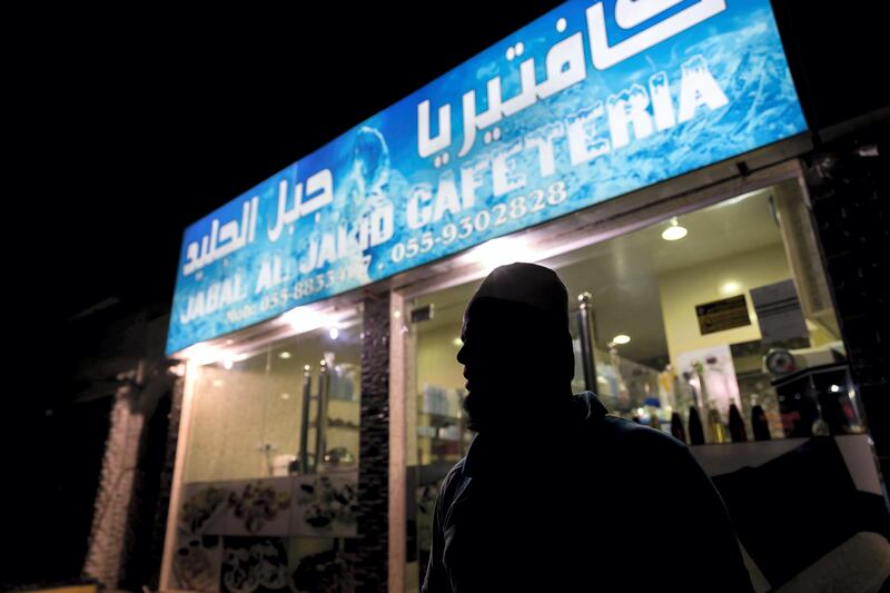 Ras Al Khaimah, United Arab Emirates - September 20th, 2017: A worker outside Jabal Al Jalid Cafeteria. A traditional fishing neighbourhood in Old RAK has been transformed by karak coffee and tea shops that have popped up in the last two years. Wednesday, September 20th, 2017, Old RAK, Ras Al Khaimah. Chris Whiteoak / The National