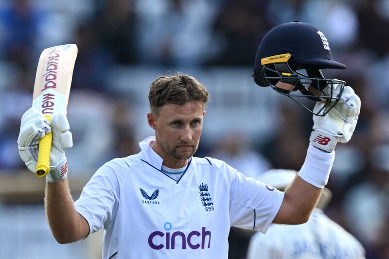 England's Joe Root celebrates reaching his century. AFP
