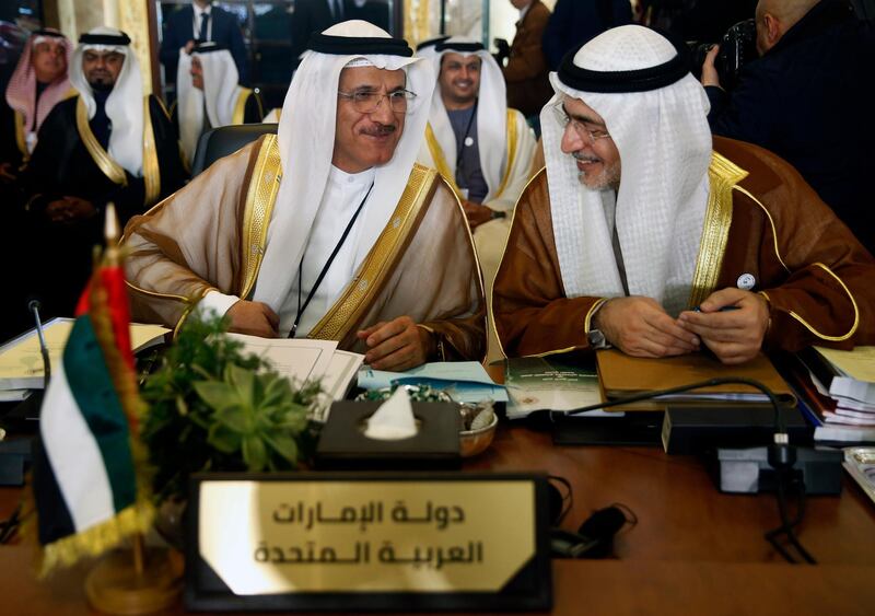 UAE's Minister of Economy Sultan Al Mansouri, left, with Mohammed al Hashimi, right. AP Photo