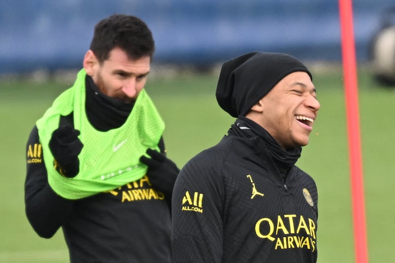 Kylian Mbappe and Lionel Messi during training. AFP