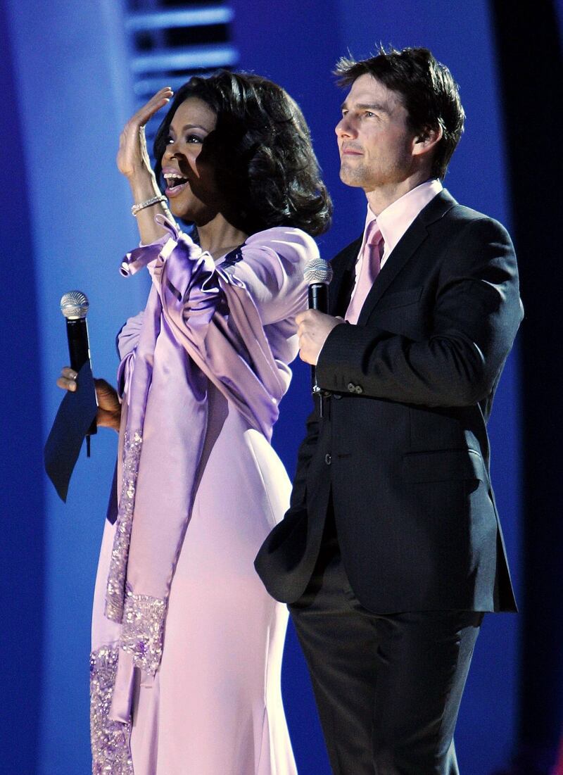 epa000328455 US talk show host Oprah Winfrey (L) and US actor Tom Cruise (R) officiate at the Nobel Peace Prize Concert in Oslo, Saturday 11 December 2004. They introduced the numerous artists paying homage to this year's Nobel Peace Prize laureate Kenyan environmentalist Wangari Maathai.  EPA/Erlend Aas