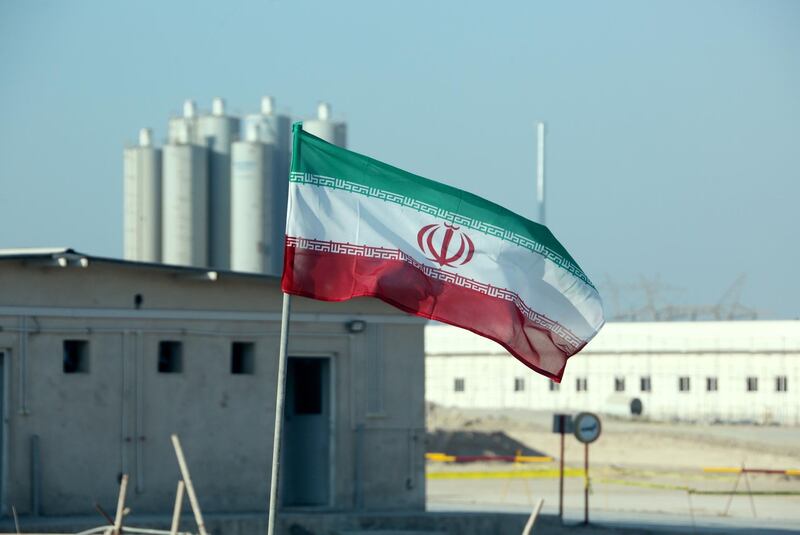 (FILES) This file photo taken on November 10, 2019 shows an Iranian flag in Iran's Bushehr nuclear power plant, during an official ceremony to kick-start works on a second reactor at the facility. Iran's foreign minister on June 5, 2020 threw the ball back into the US president's court over Tehran's nuclear agreement with foreign powers, after the two countries carried out a prisoner swap. President Donald Trump had voiced hope for progress with Iran a day earlier, after the Islamic republic released a US Navy veteran and the United States freed two Iranians. / AFP / ATTA KENARE
