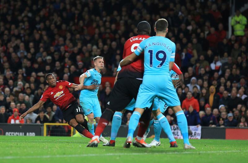 Manchester United's Anthony Martial, left, shoots and scores his side's second goal. AP Photo