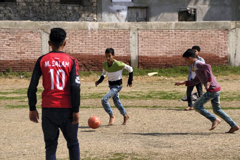 March 10, 2018- Nagrig, Egypt-  Young boys play football in the yard near the youth center, that was recently renamed for the village's local hero, Mohamed Salah. (Dana Smillie for The National)