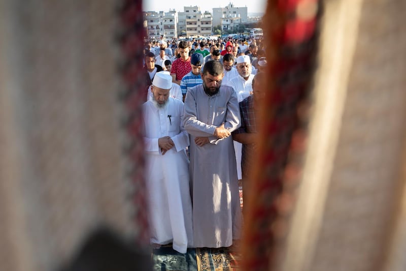 Muslims perform the Eid Al Adha morning prayer, in Amman, Jordan.  EPA