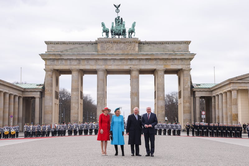 First Lady Elke Buedenbender, Queen Camilla, King Charles and German President Frank-Walter Steinmeier arrive for a Ceremonial welcome at Brandenburg Gate in Berlin in March 