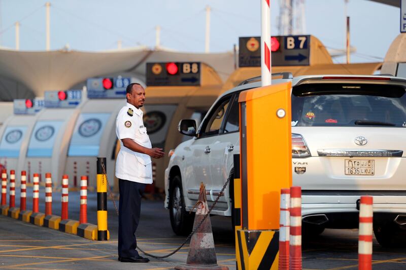 Saudi motorists queue at the Bahrain immigration check point to cross the King Fahd Causeway into Bahrain.  Reuters