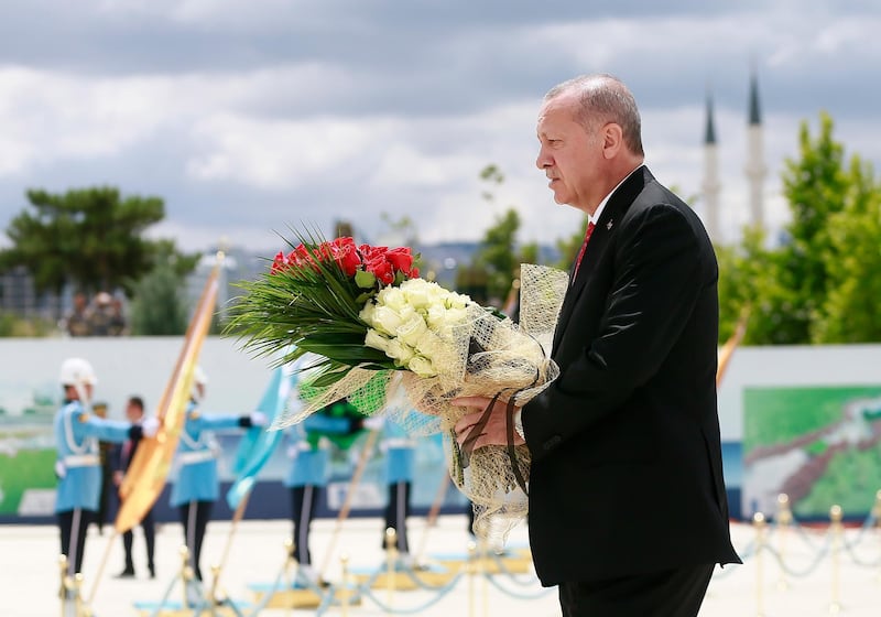 Turkish President Recep Tayyip Erdogan (C) visiting Martyrs Memorial on the third anniversary of the failed coup attempt at the Presidential Palace in Ankara, Turkey.  EPA