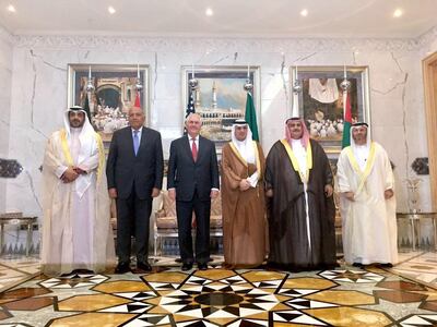 U.S. Secretary of State Rex Tillerson takes a photo with the Foreign Ministers of Saudi Arabia, Egypt, UAE, and Bahrain, and the Kuwaiti Minister of State for Cabinet Affairs after a meeting in Jiddah, Saudi Arabia, on Thursday, July 13, 2017. (U.S. State Department via AP)