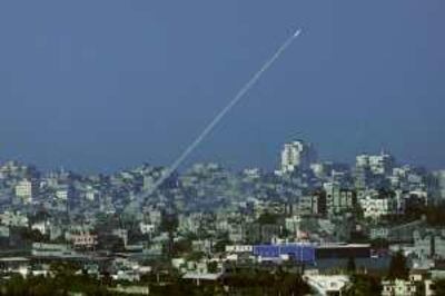 FILE - In this Jan 7, 2009 file photo, a rocket fired by Palestinian militants in the Gaza Strip is seen from southern Israel, near Israel's border with the Gaza Strip. The Hamas government in Gaza distanced itself Saturday, Feb. 6, 2010 from an earlier statement in which it expressed regret for harming Israeli civilians in rocket attacks. The apology was part of the government's response to a U.N. report that alleged both Hamas and Israel committed war crimes during Israel's Gaza offensive last winter. The U.N. report accused Hamas of firing rockets indiscriminately at Israeli civilians. (AP Photo/Dan Balilty, File) *** Local Caption ***  TTW101_MIDEAST_ISRAEL_PALESTINIANS.jpg