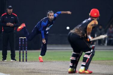 Ex South Africa international Imran Tahir bowls for Interglobe Marine during the game between Interglobe Marine and Bukhatir XI in the CBFS T20 league in Sharjah. Chris Whiteoak/ The National