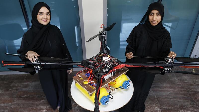 In 2015, Khalifa University students Alaya Al Maaizmi, left, and Mouza Al Shemaili, built a drone to clear fog from airport runways. Antonie Robertson / The National