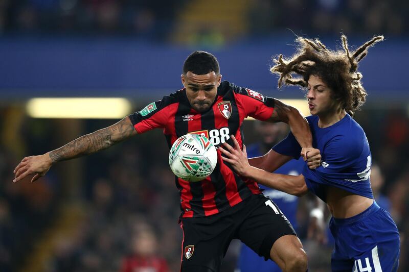 Bournemouth's Callum Wilson controls the ball despite the pressure of Chelsea's Ethan Ampadu. Catherine Ivill / Getty Images