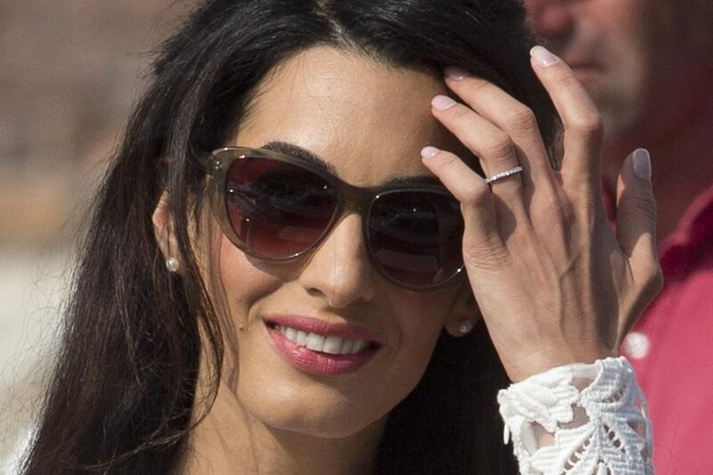 Amal Alamuddin, wearing her nuptial ring, leaves the Aman hotel in Venice. AP 
