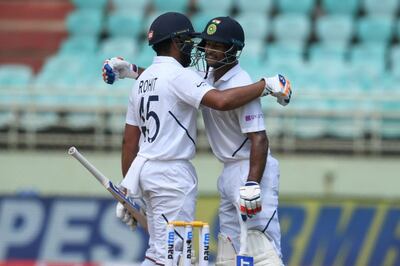 Indian cricketer Mayank Agarwal (R) and Rohit Sharma (L) greet each other during the first day's play of the first Test match between India and South Africa at the Dr. Y.S. Rajasekhara Reddy ACA-VDCA Cricket Stadium in Visakhapatnam on October 2, 2019. ----IMAGE RESTRICTED TO EDITORIAL USE - STRICTLY NO COMMERCIAL USE----- / GETTYOUT
 / AFP / NOAH SEELAM / ----IMAGE RESTRICTED TO EDITORIAL USE - STRICTLY NO COMMERCIAL USE----- / GETTYOUT
