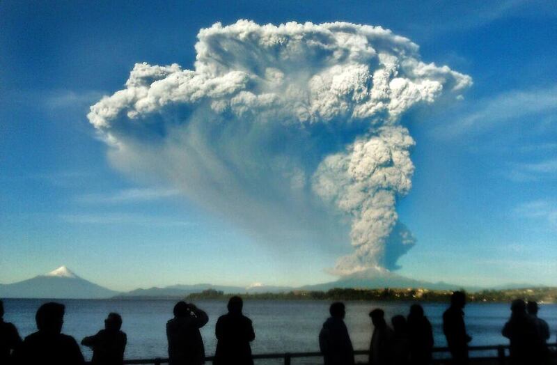 People from Puerto Varas, southern Chile, watch the Calbuco volcano, on April 22, 2015. Giordana Schmidt / AFP Photo