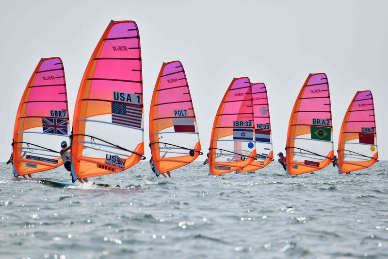 Athletes take part in the women's windsurfing RS:X class competition during a sailing test event for the Tokyo 2020 Olympic Games, off the coast Enoshima in Kanagawa Prefecture.  AFP