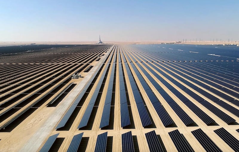 This screenshot from undated footage released by Strategy & Government Communications of Dubai, shows the Mohammed bin Rashid Al Maktoum Solar Park, about 50 kilometres south of Dubai, United Arab Emirates. In the oil-rich UAE, an unusual sight is rising in Dubai -- a coal-fired power plant, a first for the region. The $3.4 billion Hassyan power plant in Dubai appears puzzling as the UAE hosts the headquarters of the International Renewable Energy Agency. (Strategy & Government Communications of Dubai via AP)
