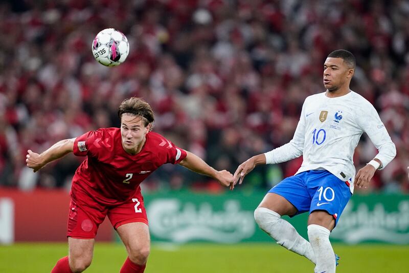 Denmark's Joachim Andersen, left, and Frances Kylian Mbappe in action. AP