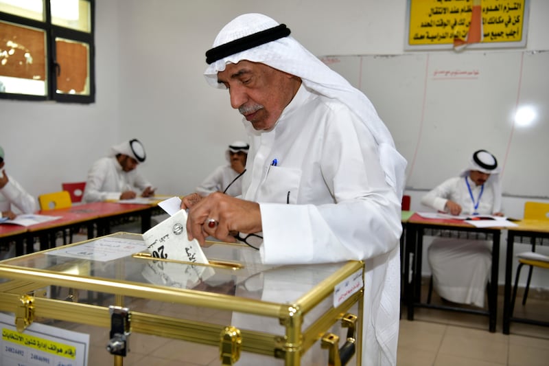 A man votes in Al Riqqa district. AP