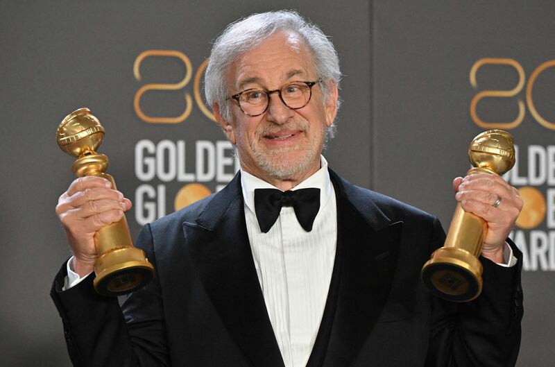 Steven Spielberg poses with the Golden Globes for Best Director and Best Picture for 'The Fabelmans'. AFP