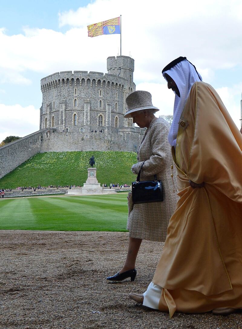 Britain's Queen Elizabeth (L) speaks with United Arab Emirates President Sheikh Khalifa bin Zayed al-Nahayan (2nd R) after a review of an honour guard during a ceremonial welcome at Windsor Castle, in Windsor, southern England April 30, 2013. The President is paying a state visit to Britain from April 30 to May 1. REUTERS/Toby Melville (BRITAIN - Tags: ROYALS ENTERTAINMENT POLITICS) *** Local Caption ***  TOB503_BRITAIN-_0430_11.JPG