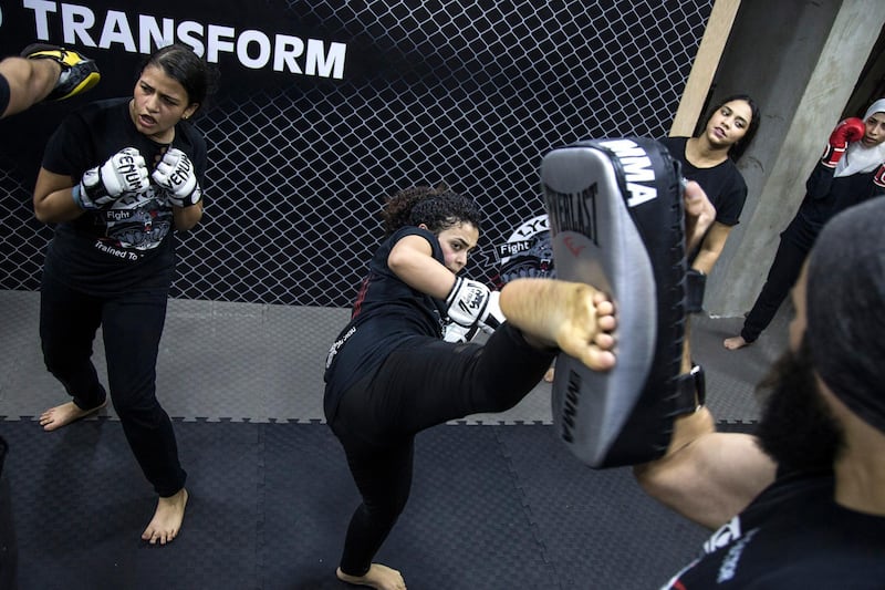 Women going through their exercise during a class in Mixed Martial Arts (MMA) in Giza, south-west of Cairo the International Day for the Elimination of Violence Against Women.  EPA