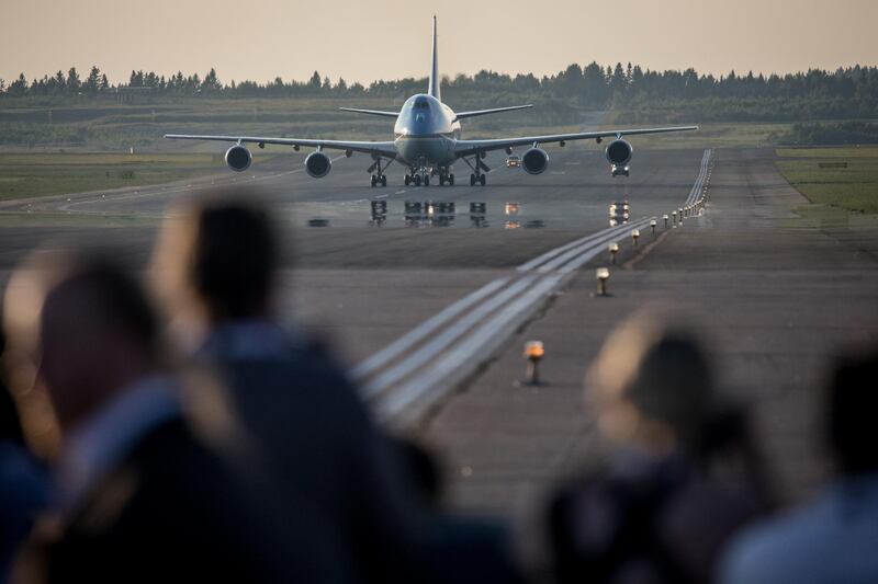 HELSINKI, FINLAND - JULY 15: Members of the press take photographs as Air Force One arrives carrying U.S. President Donald Trump and first lady, Melania Trump at Helsinki International Airport on July 15, 2018 in Helsinki, Finland.President Trump arrived in Helsinki, for talks with Russian President Vladimir Putin. Trump said in a recent statement that he has " low expectations" for the meeting, however he is under increasing pressure to confront the Russian President directly about special counsel Robert Mueller's indictment of twelve Russians said to have conspired to sway the decision of the 2016 US election.  (Photo by Chris McGrath/Getty Images)