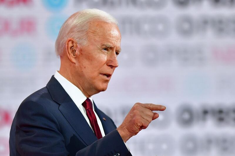 (FILES) In this file photo taken on December 19, 2019 Democratic presidential hopeful former Vice President Joe Biden gestures during the sixth Democratic primary debate of the 2020 presidential campaign season co-hosted by PBS NewsHour & Politico at Loyola Marymount University in Los Angeles, California.  Donald Trump's order to kill a top Iranian commander has laid bare Washington's stark political divide, with Republicans rallying behind the president and Democrats warning that January 3, 2020 attack could trigger a devastating military confrontation. / AFP / Frederic J. BROWN

