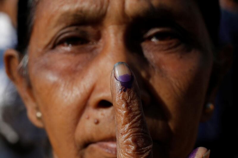 A woman shows her ink-stained finger after voting at a polling centre during the first phase of general election in Alipurduar district in the eastern state of West Bengal. Reuters