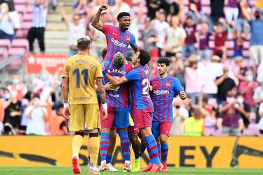 BARCELONA, SPAIN - SEPTEMBER 26: Ansu Fati of FC Barcelona celebrates with Ronald Araujo after scoring their side's third goal during the LaLiga Santander match between FC Barcelona and Levante UD at Camp Nou on September 26, 2021 in Barcelona, Spain. (Photo by David Ramos / Getty Images)