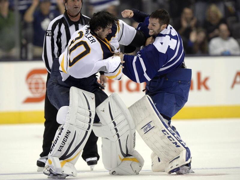 Buffalo Sabres goalie Ryan Miller exchanges blows with Toronto Maple Leafs goalie Jonathan Bernier during the third period of their pre-season game at Toronto on Sunday. Frank Gunn / AP Photo