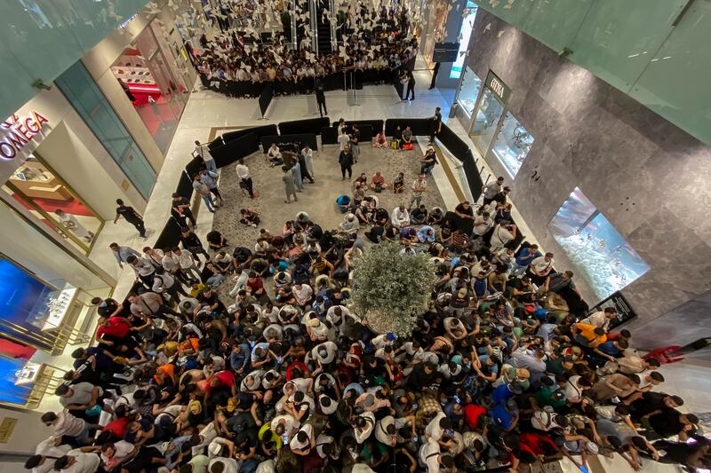 People queue for the iPhone 15 at Mall of the Emirates in Dubai. Antonie Robertson / The National